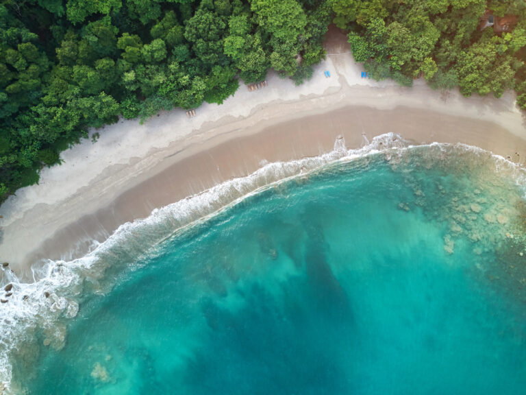 Tropical beach with turquoise water and white sand in Central America